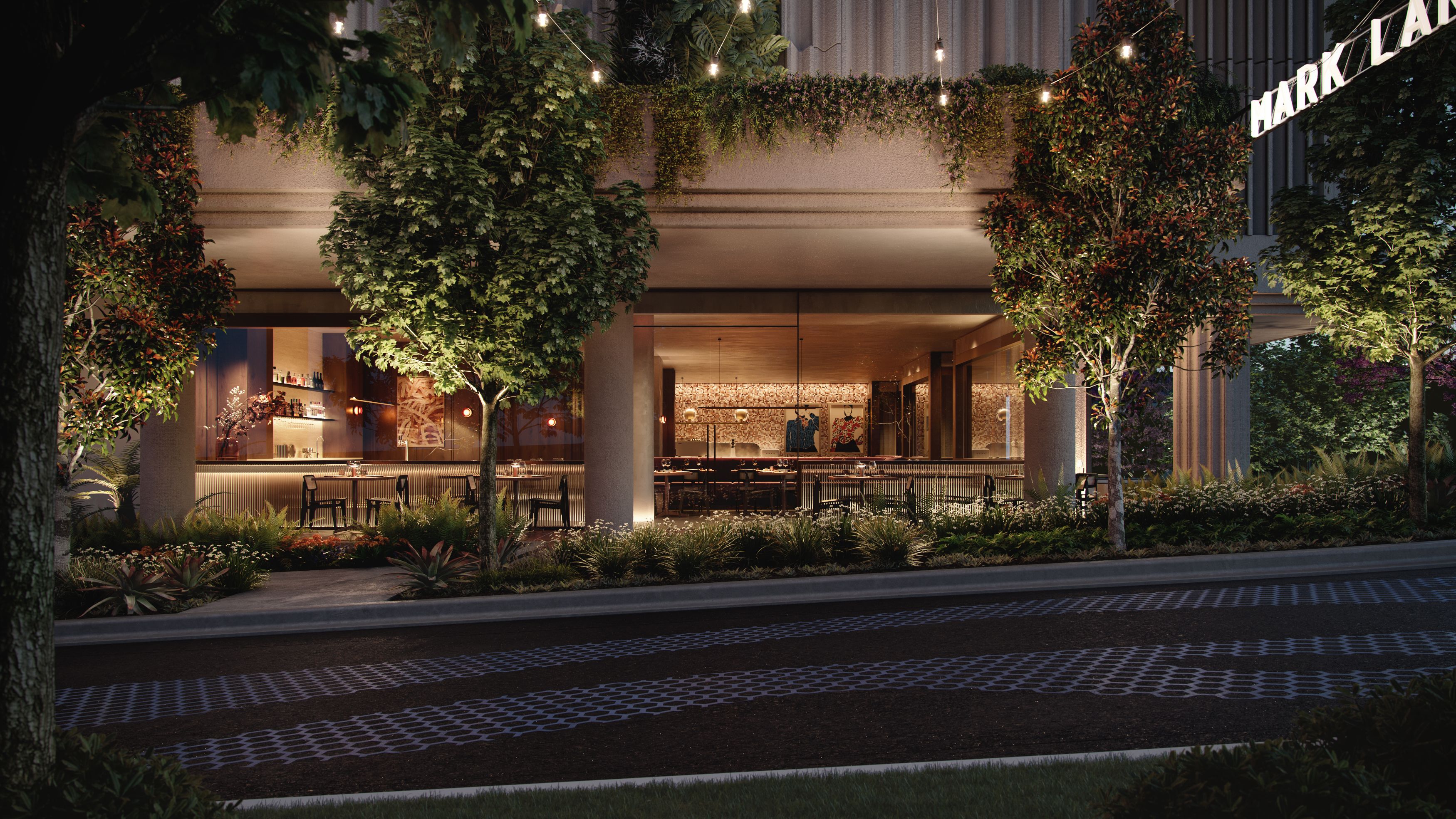 Mark Lane precinct at Cliff by Aria in Brisbane, featuring landscaped streetscape, ambient lighting, and modern ground-floor dining spaces.