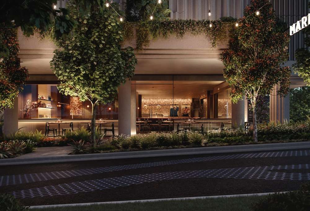 Mark Lane precinct at Cliff by Aria in Brisbane, featuring landscaped streetscape, ambient lighting, and modern ground-floor dining spaces.