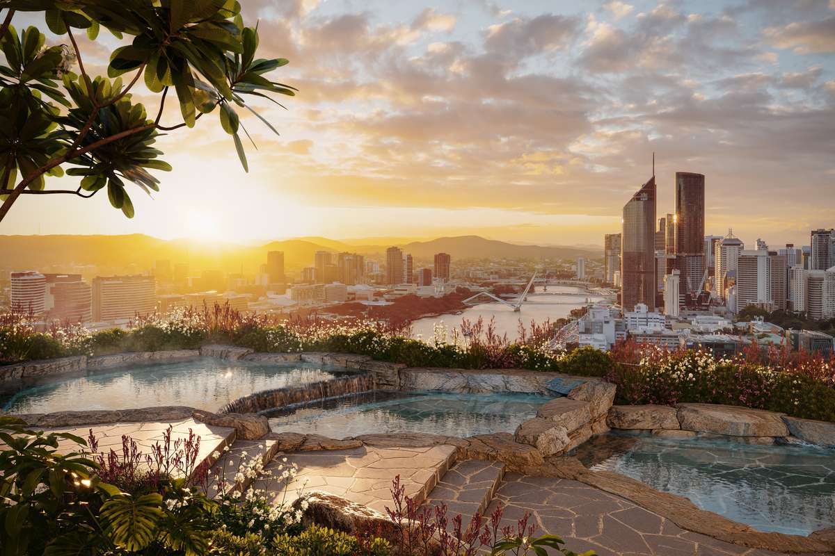 Rooftop infinity rock pools at Cliff by Aria in Brisbane with sweeping views of the Brisbane River, city skyline, and mountains at sunset.