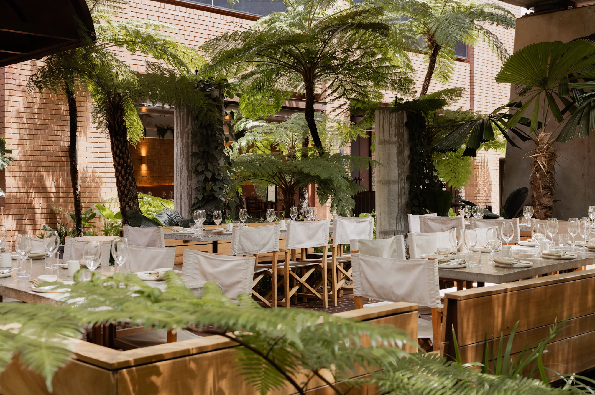Lush outdoor dining at Southside, located in Fish Lane by Aria in South Brisbane.