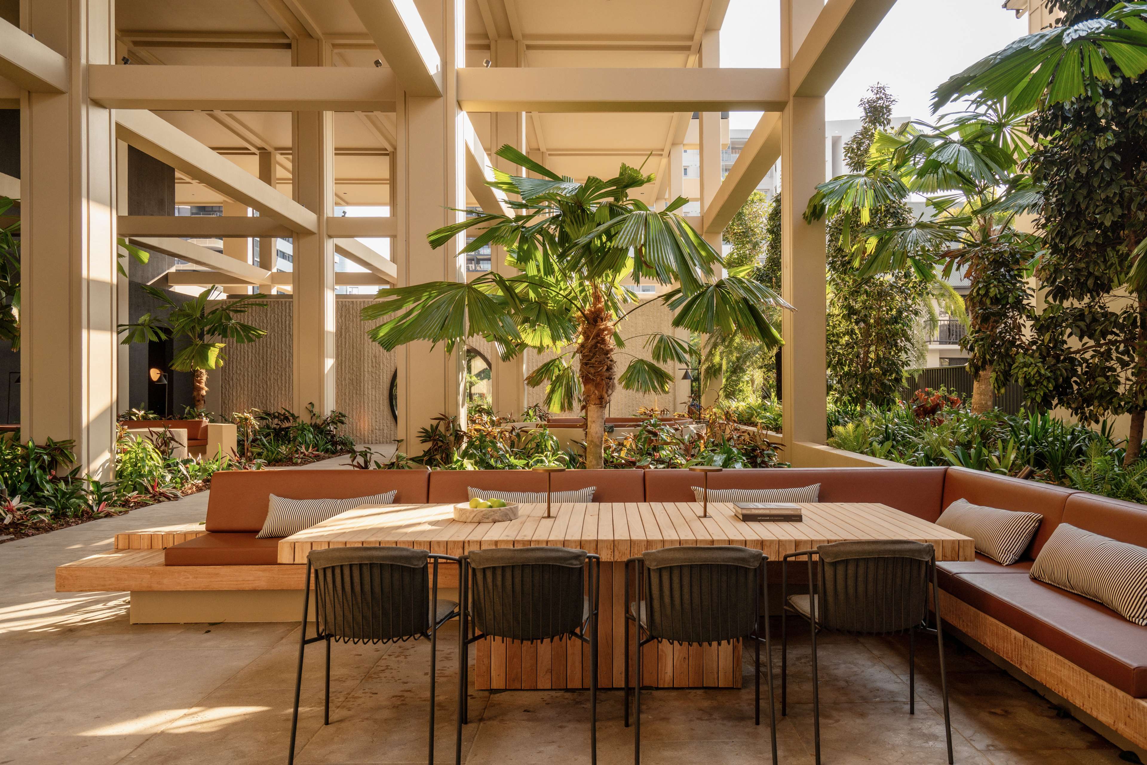 Outdoor dining table among the rooftop gardens at Trellis by Aria