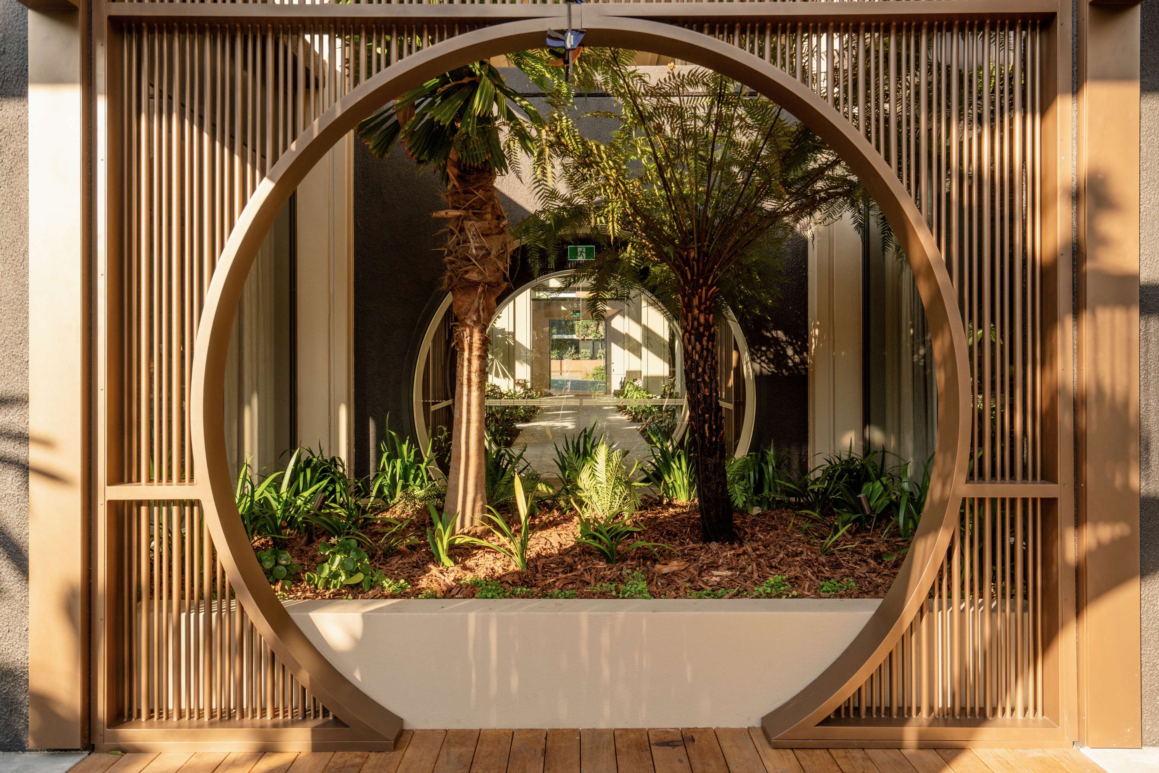 Moon gate garden feature at Trellis by Aria