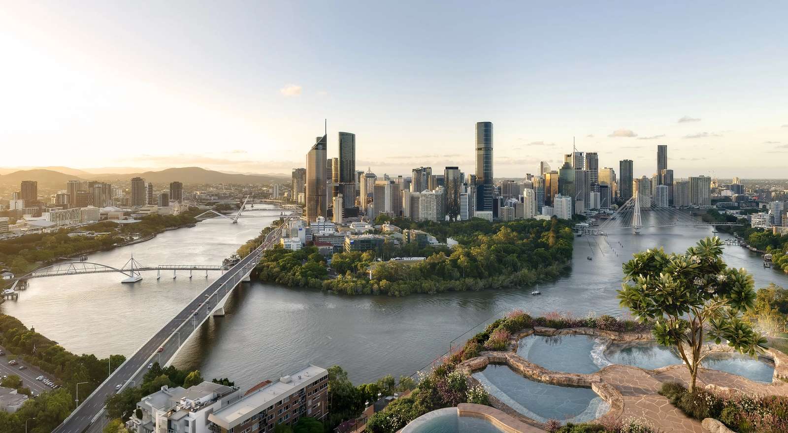 Rooftop infinity rock pools at Cliff by Aria in Brisbane with sweeping views of the Brisbane River, city skyline, and mountains at sunset.