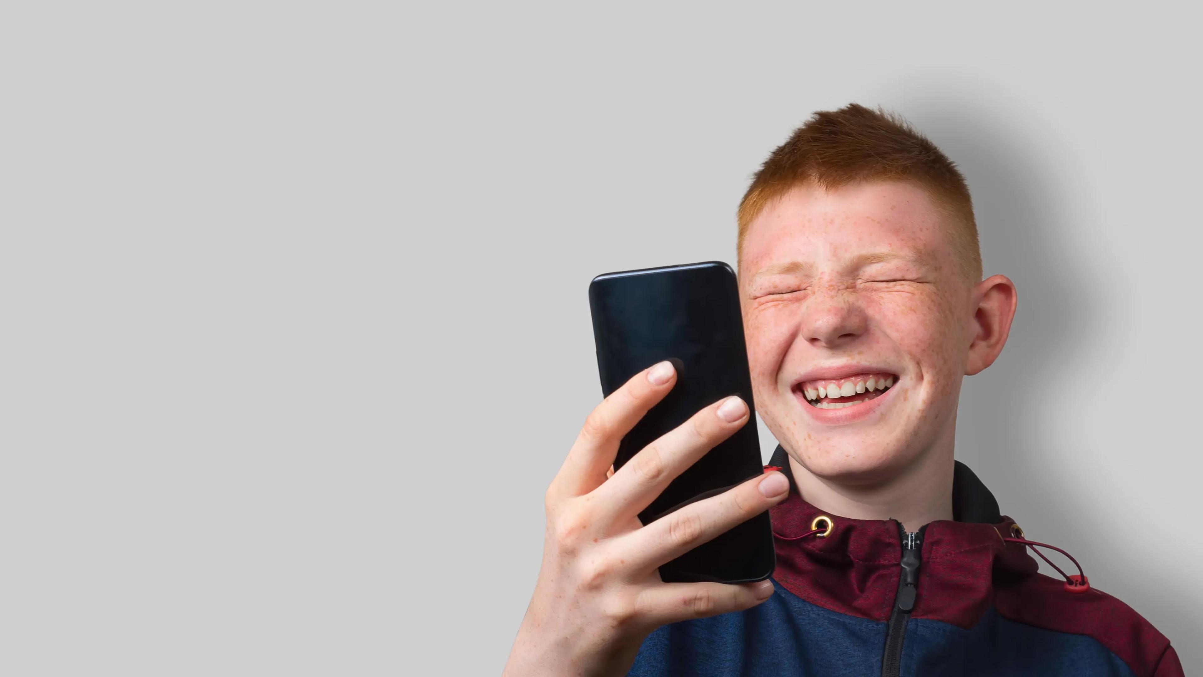 Happy boy with smartphone