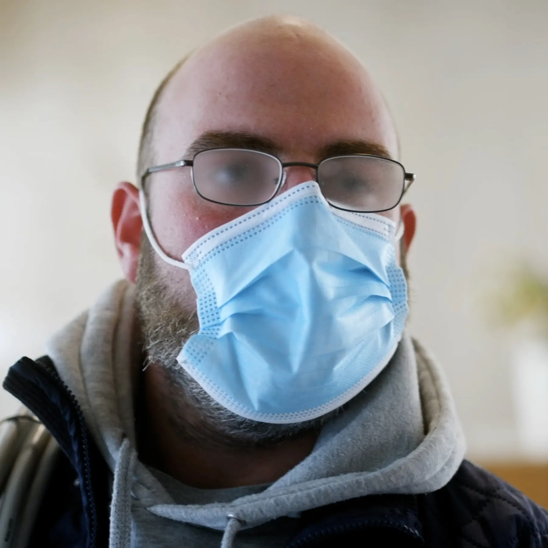 Man with foggy glasses