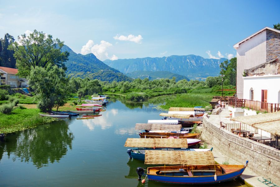 Lake Skadar National Park. Boats with a thatched roofs on the pier. Skadar lake tour