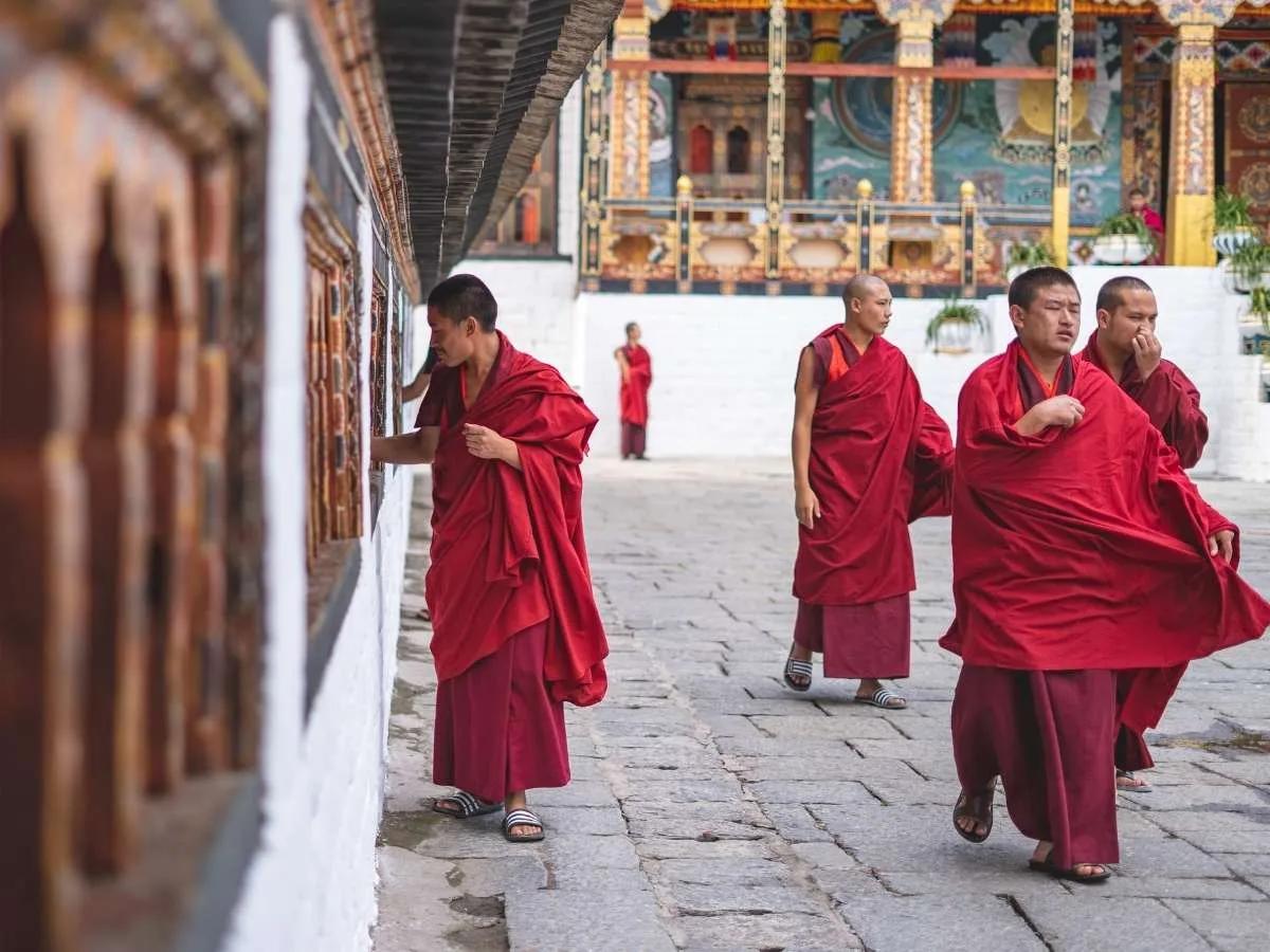 bhutan-monk-walking-monastery