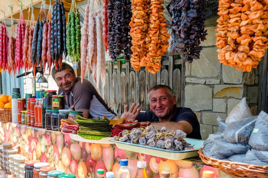 Georgian man working in small street food stall at the square in Mtskheta
