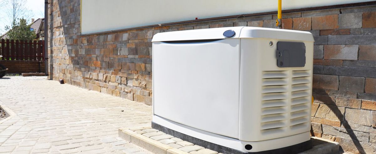 white standby generator in a residential setting