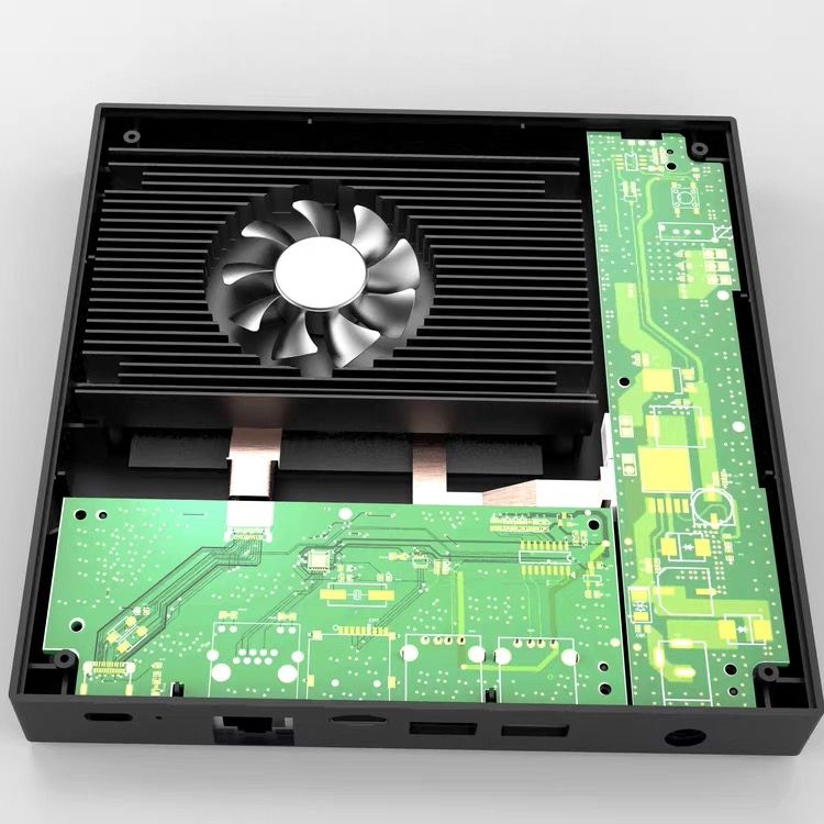 Updated Z Box internal cooling module with fan, heatsink fins, and circuit boards inside the enclosure.