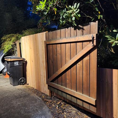 fence repair, gate moved one panel in towards the street