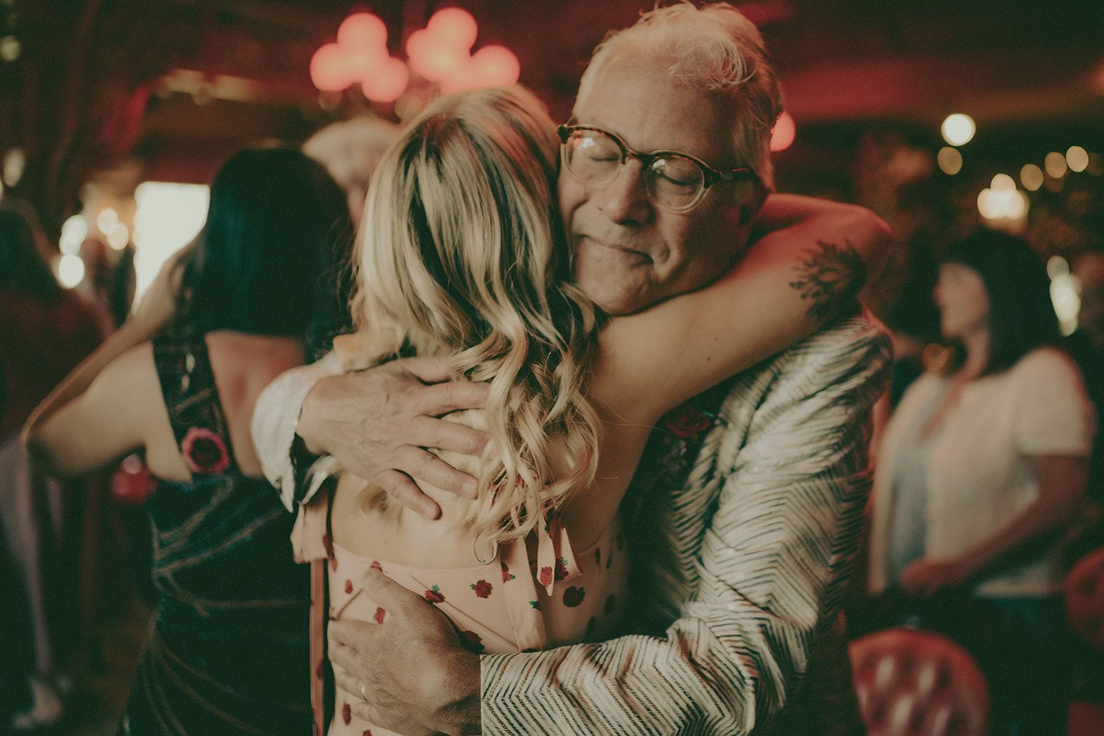 Emotional guest embrace during a Madonna Inn wedding