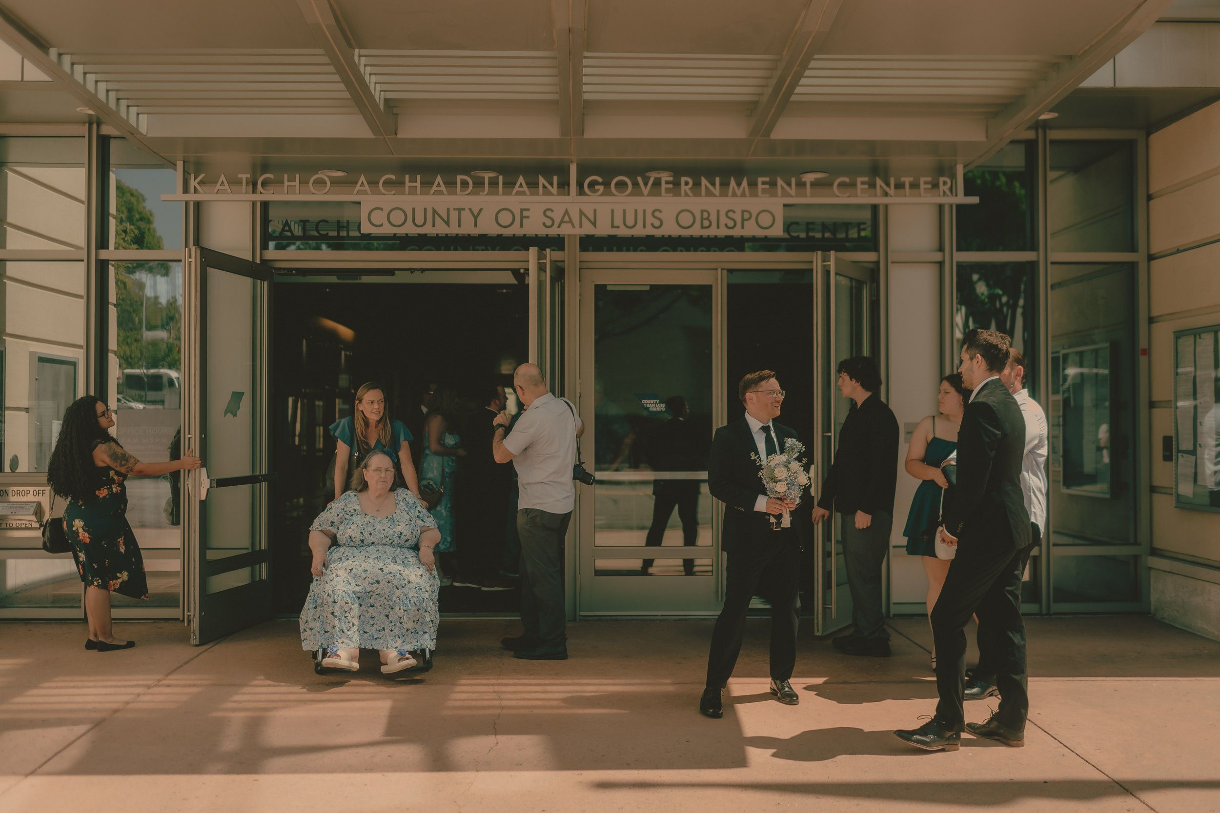 Guests gather outside the San Luis Obispo County Government Center.