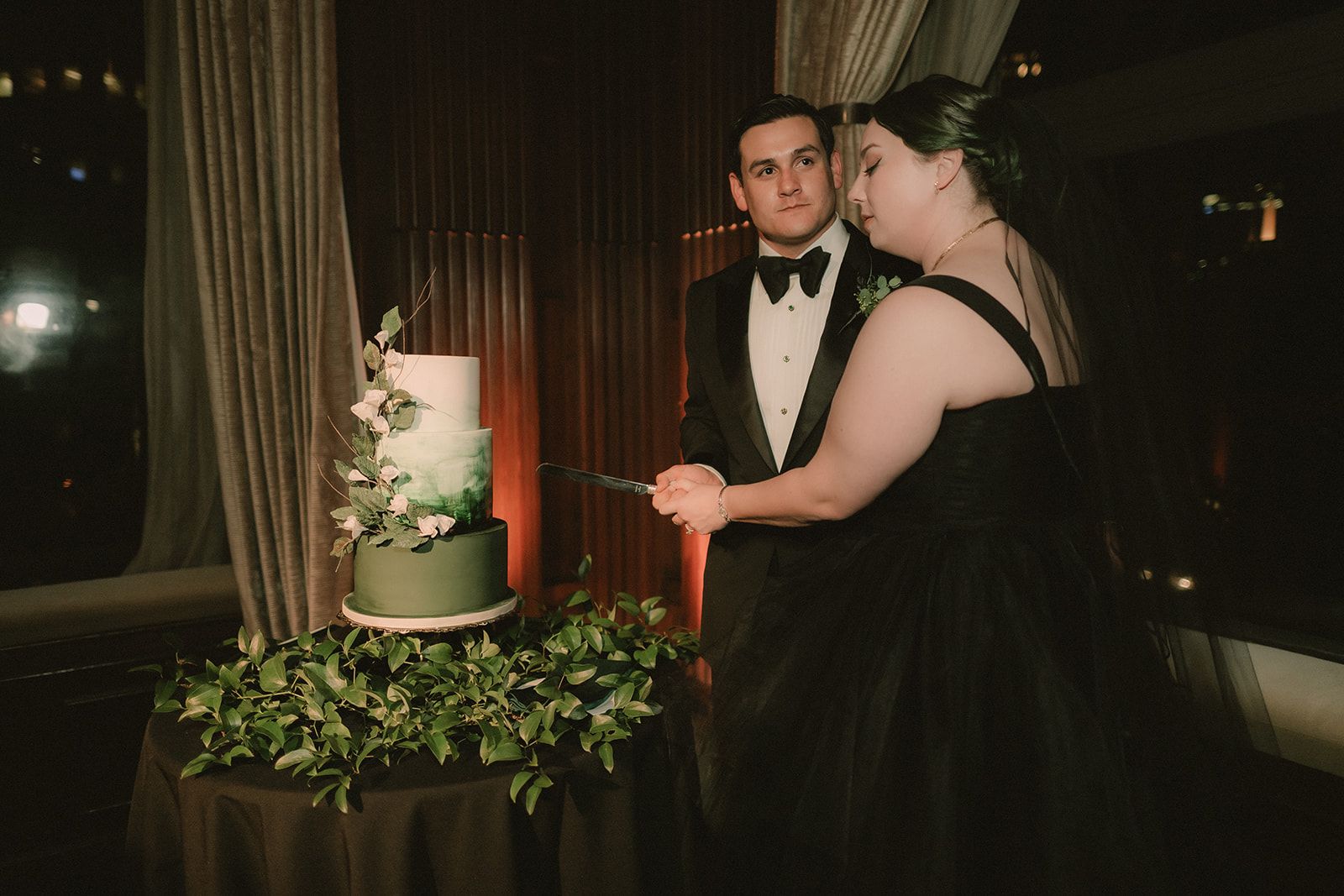 Anne and Charles cut their green wedding cake together after Anne's outfit change.