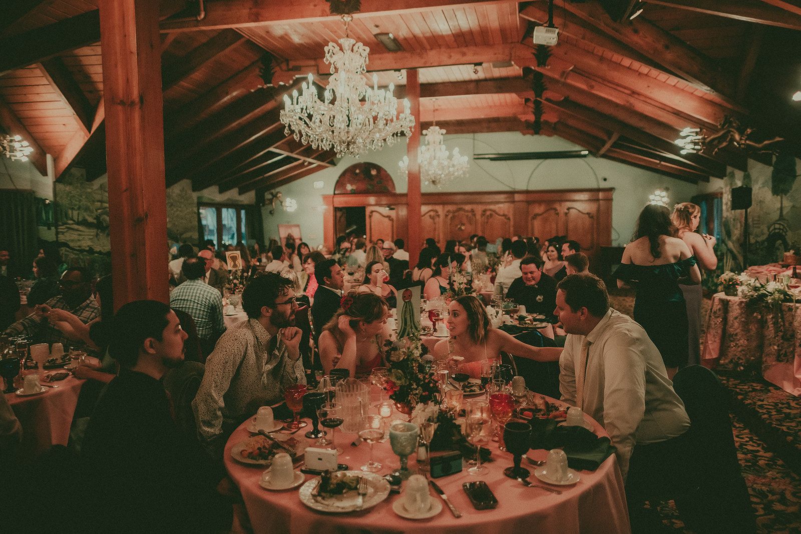 Warm wide view of a colorful Madonna Inn reception room