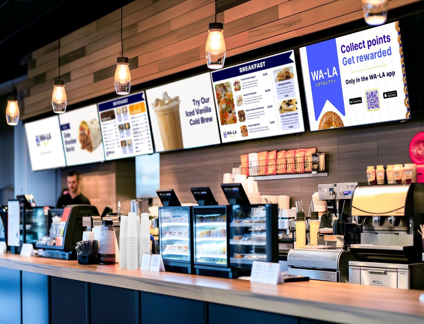 A woman paying for an order with menus displayed in the back.