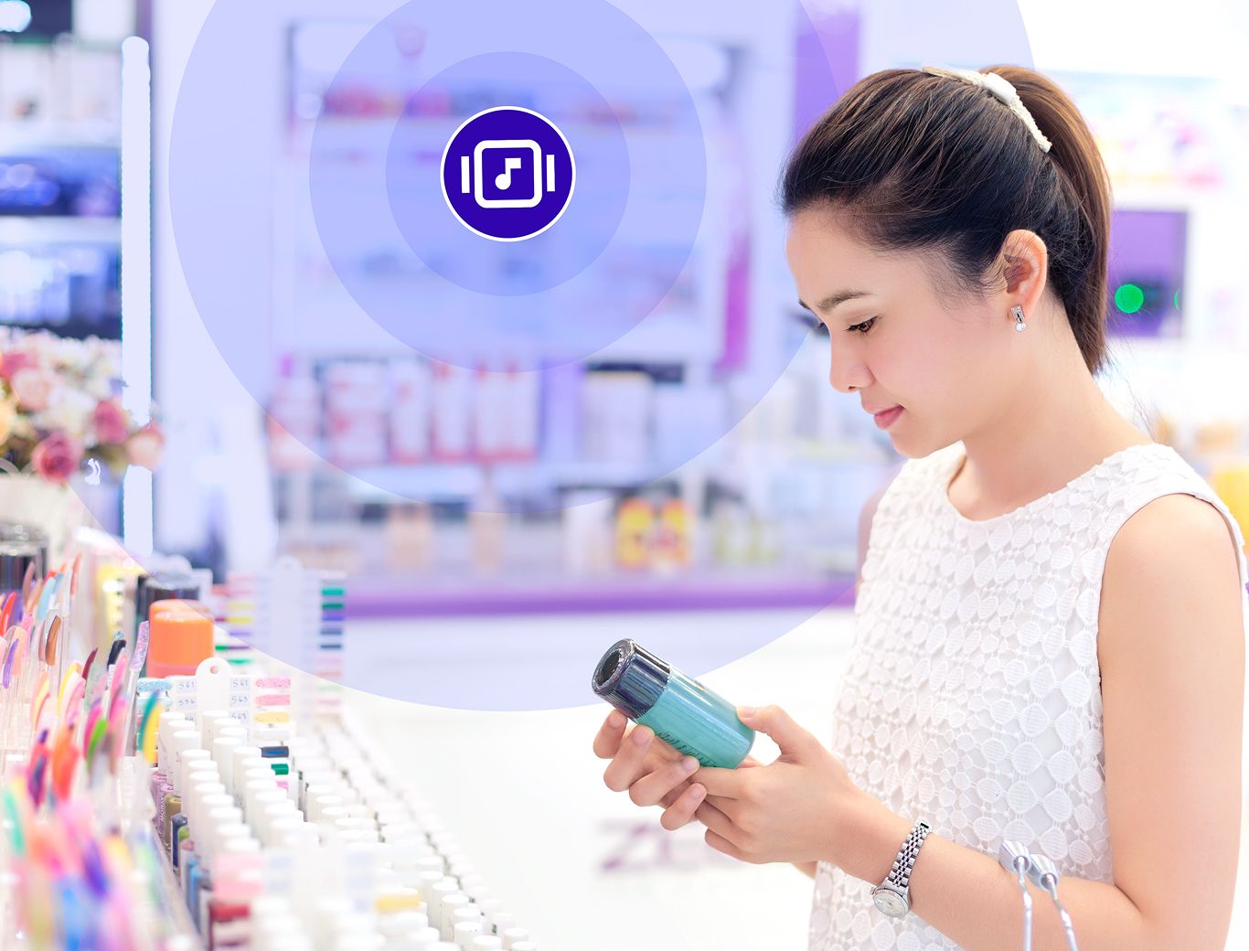 Woman looking at a beauty product with Rockbot music playing in the background