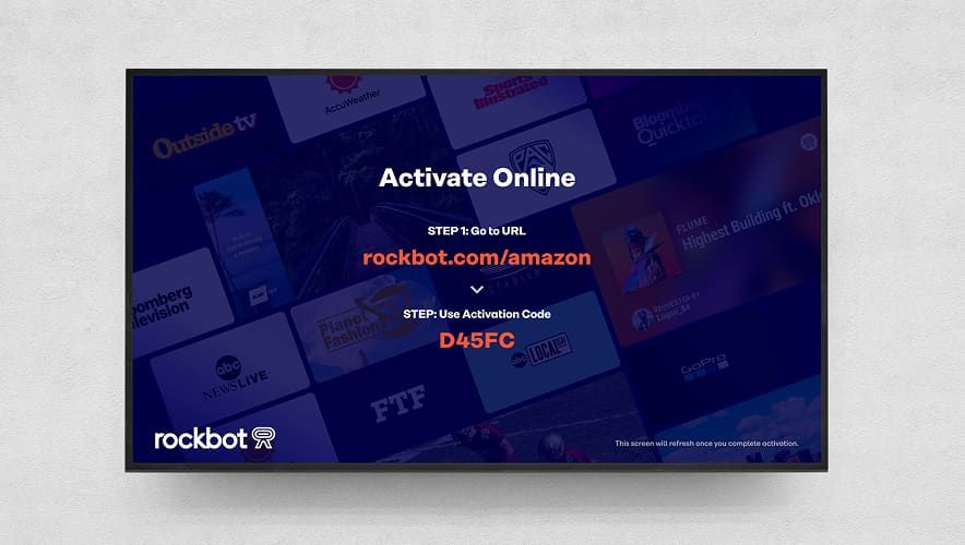 TV screen showing Rockbot activation instructions for Amazon Signage Stick setup.