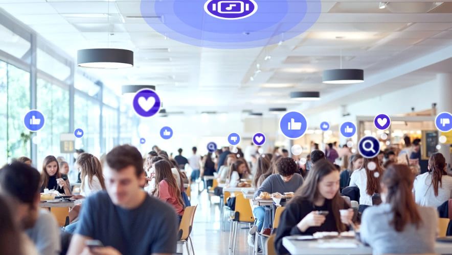 Crowded cafeteria with people on their phones requesting Rockbot Music