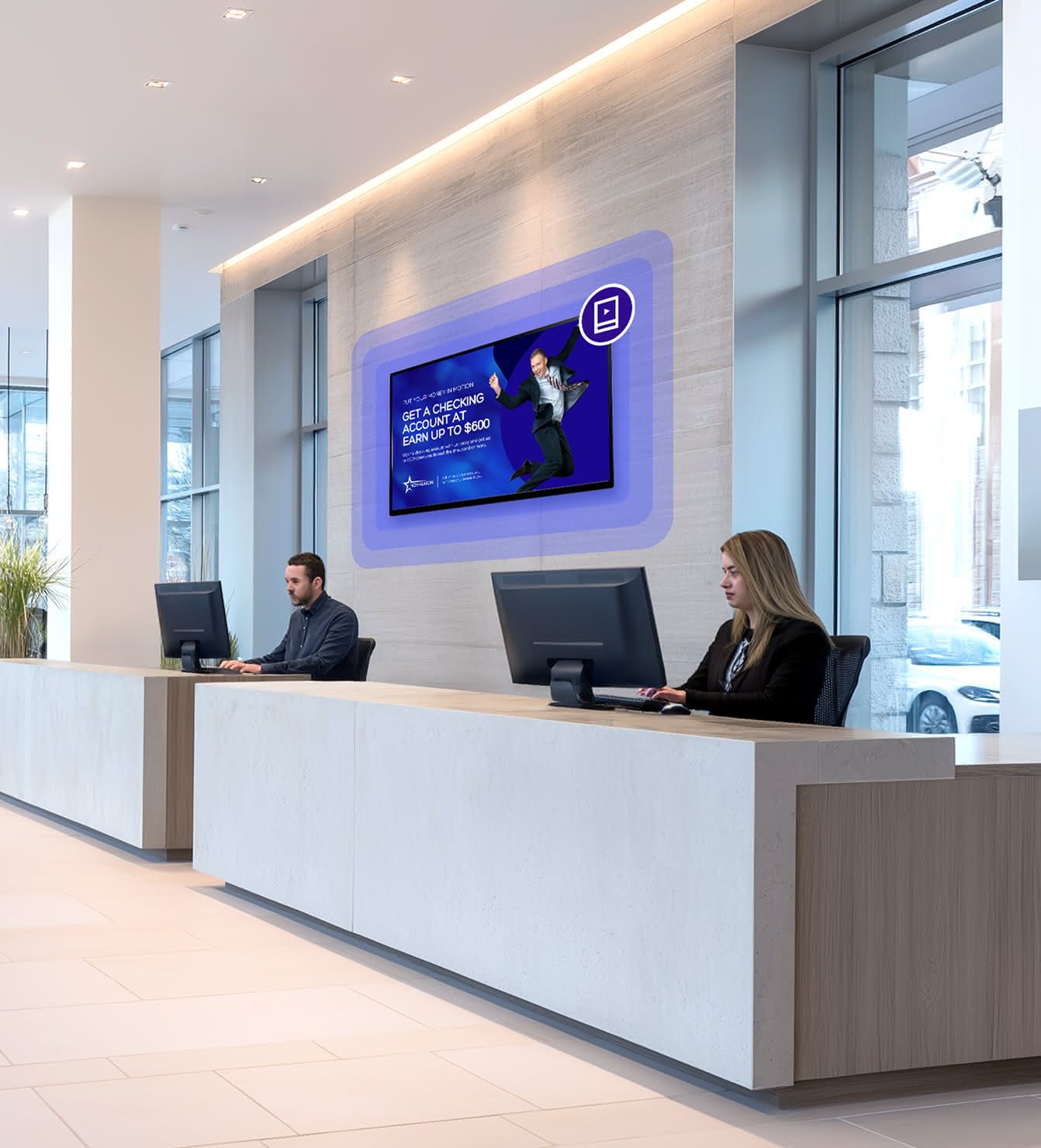 The front desk of a bank with Rockbot Digital Signage being displayed behind the employees