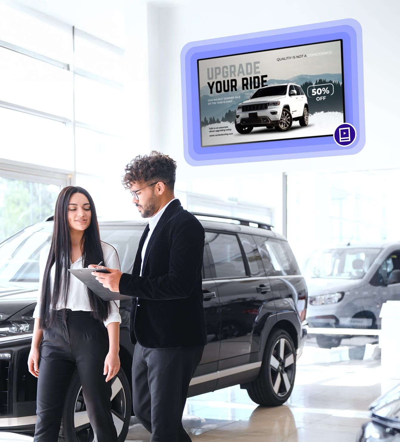 People in car showroom with digital signage screen reading: Upgrade Your Ride