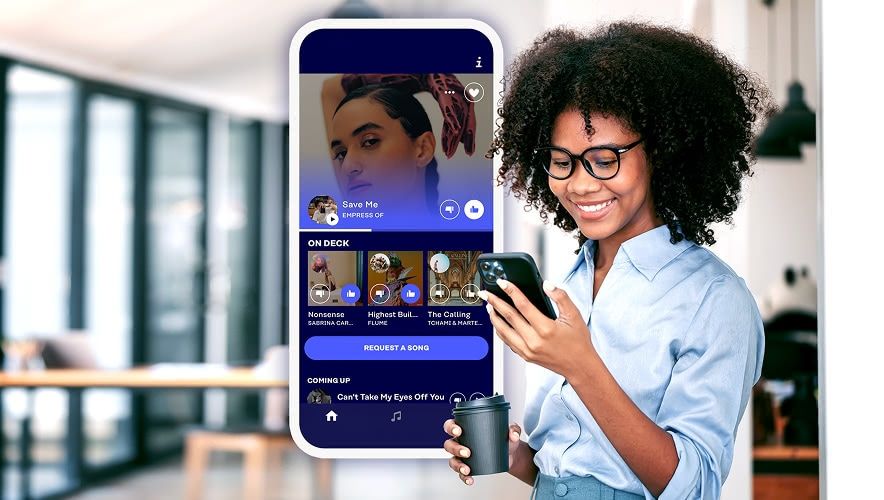 Employee using Rockbot Request to choose music on a mobile phone