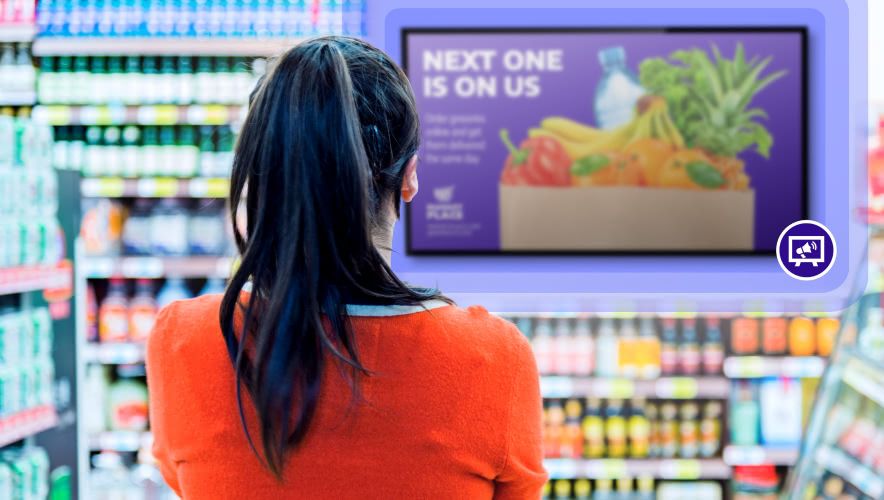 A woman in a grocery store looking at Rockbot Retail Media