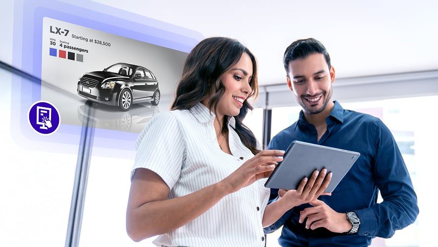 A sales woman showing car options with an interactive screen