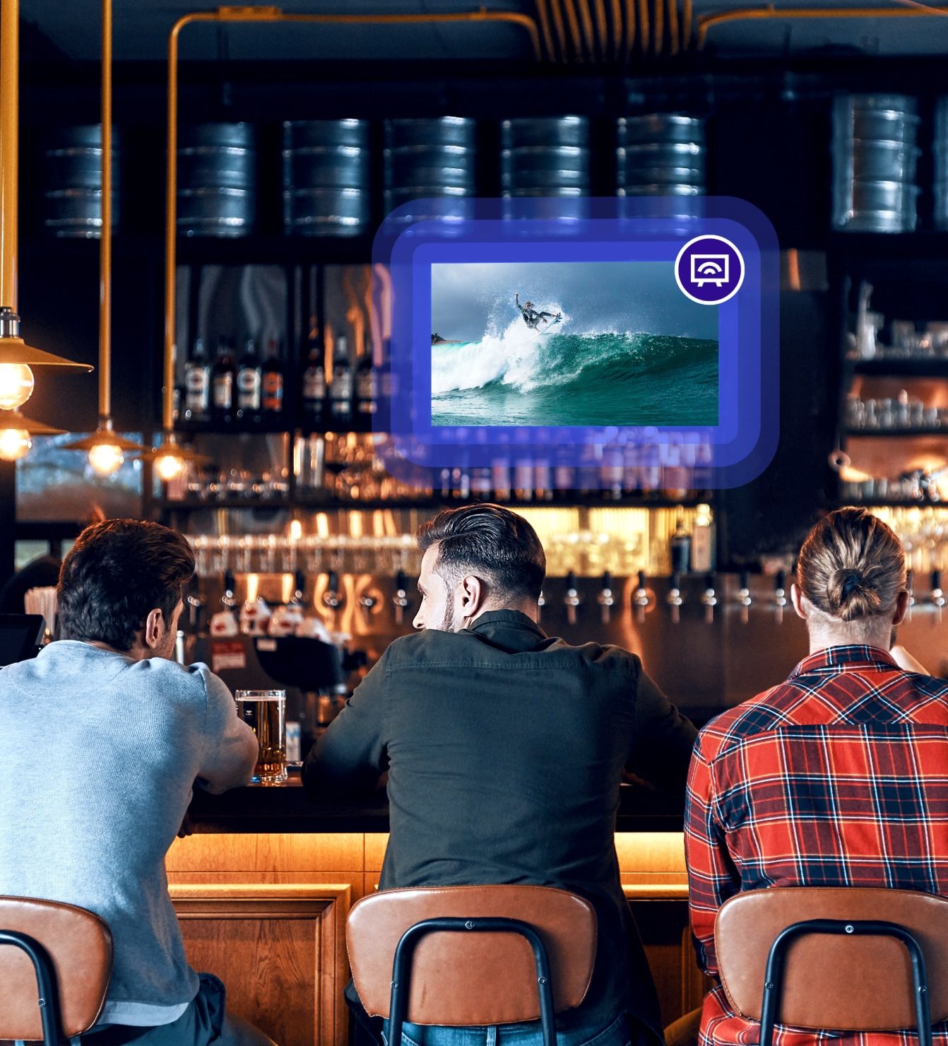 Bar patrons watching sports on mounted TV screens