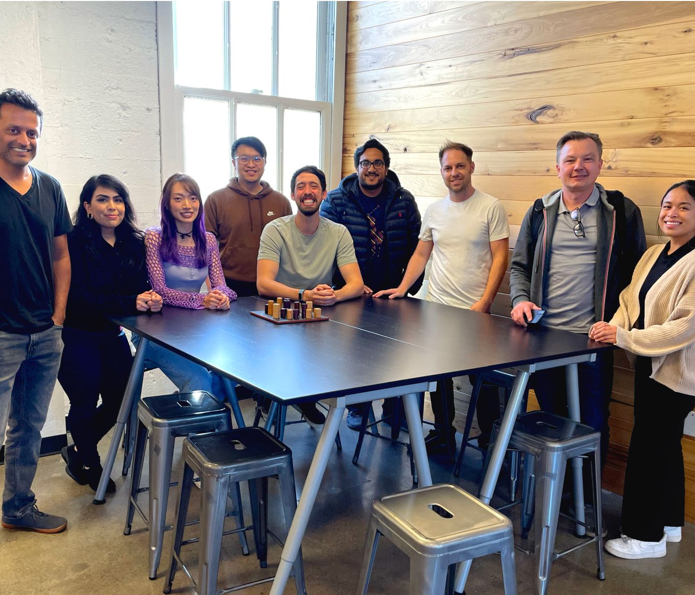 9 people posing for a picture together in the Rockbot office