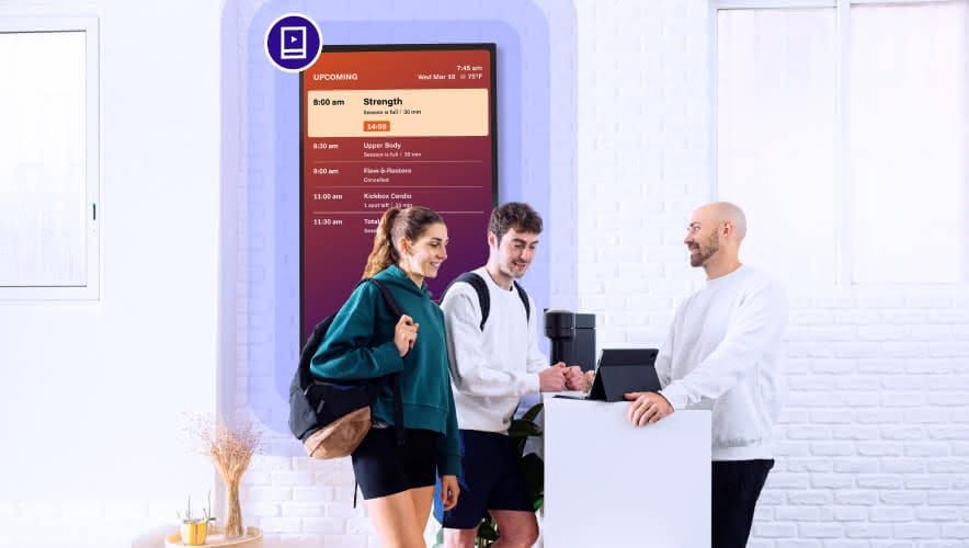 Gym staff using Rockbot digital signage to share class schedules