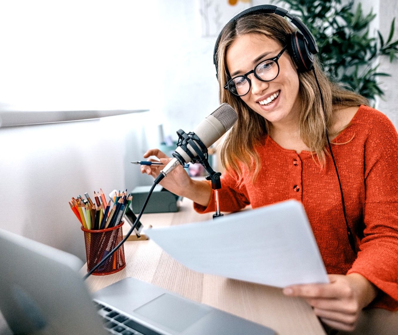 Woman at a professional microphone recording studio-quality audio content