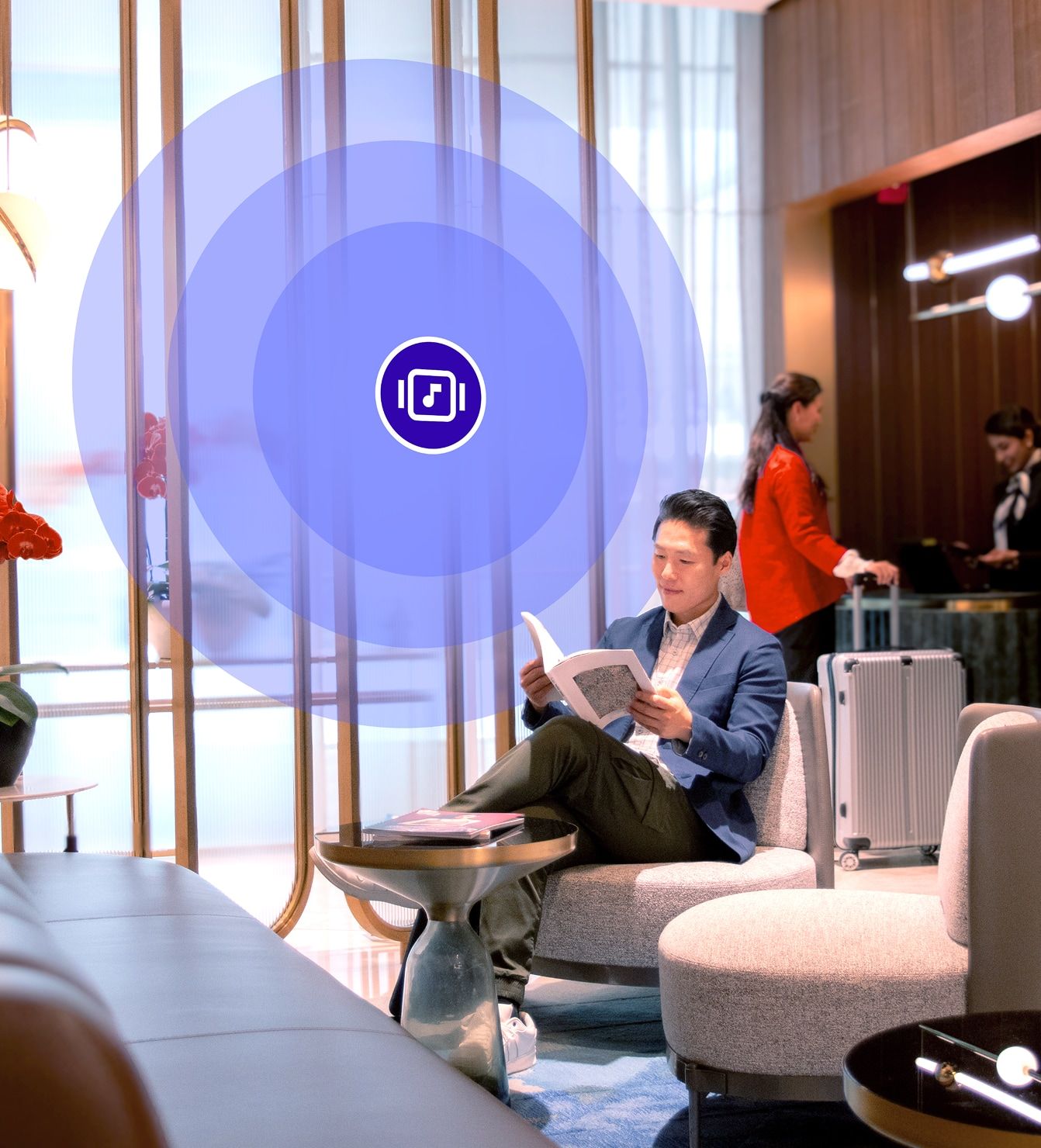 Hotel lobby with guests relaxing while licensed background music sets the mood