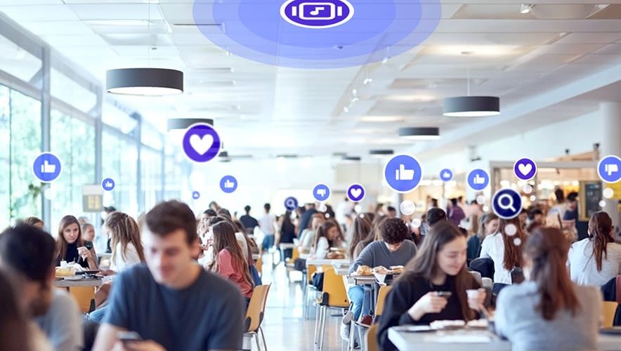 Students in a university dining hall voting on songs with Rockbot Request