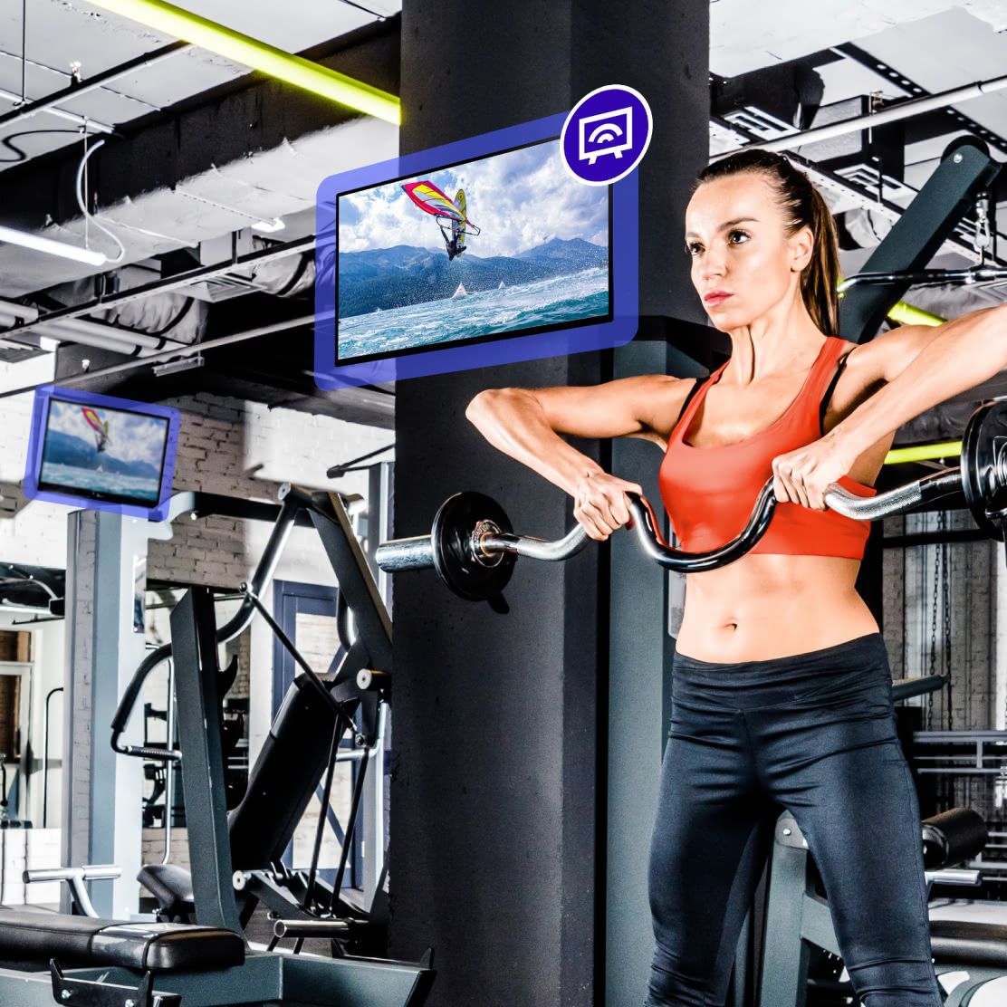 Gym floor with Rockbot TV mounted above workout equipment