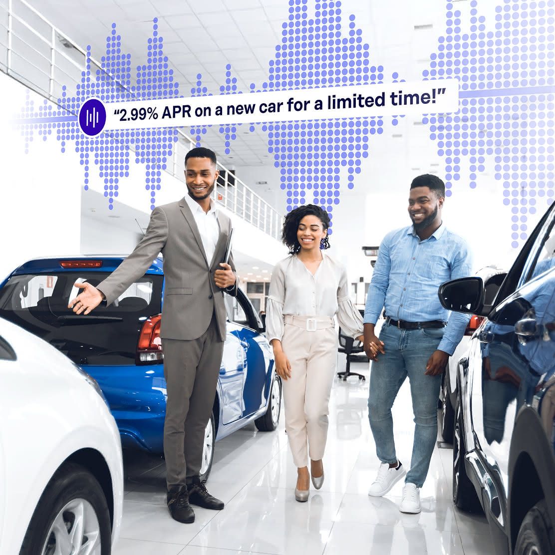 A salesman showing a couple cars while Rockbot Audio Messaging plays in the bakckground