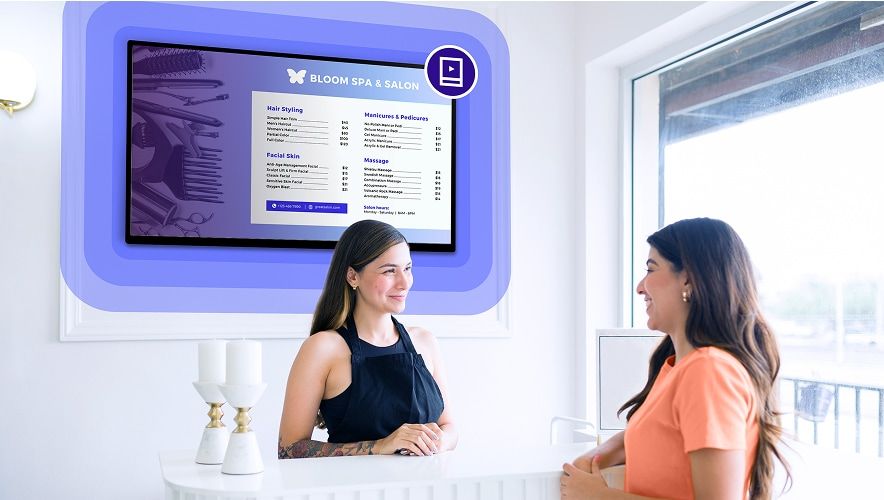 Salon reception area with digital menu board displaying services and pricing