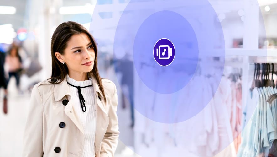 Woman window shopping with Rockbot Music playing in the background