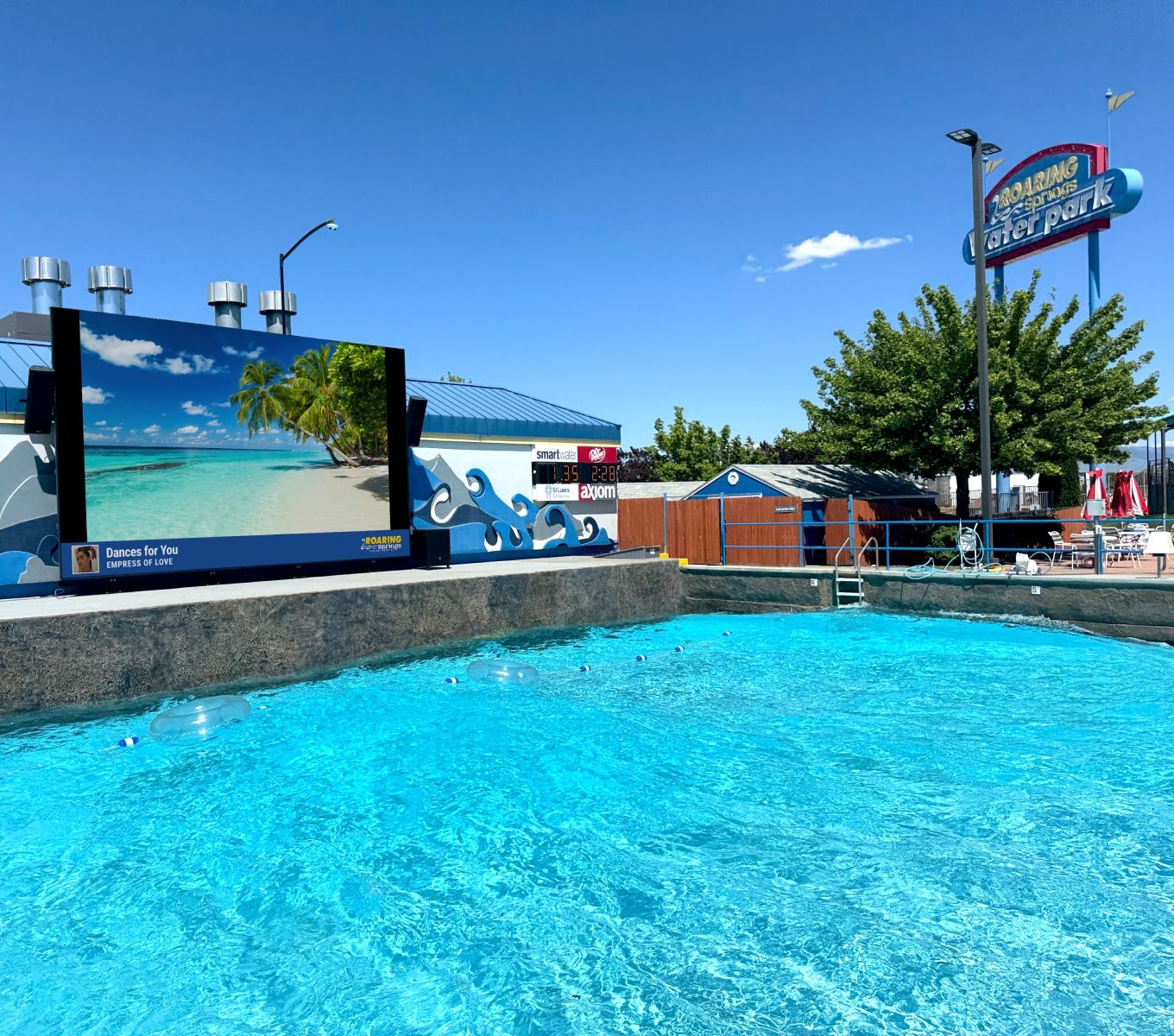Rockbot-powered video screen at Roaring Springs Wave Pool with family-friendly content