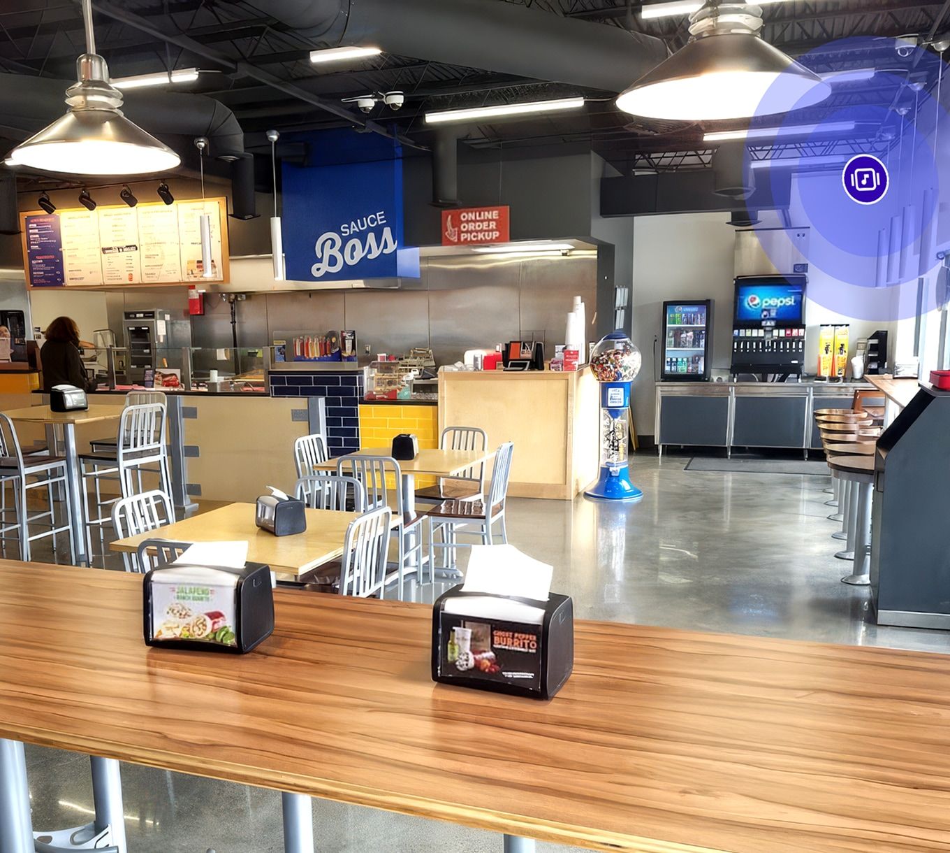 Hot Head Burritos restaurant interior with ordering counter and branded signage