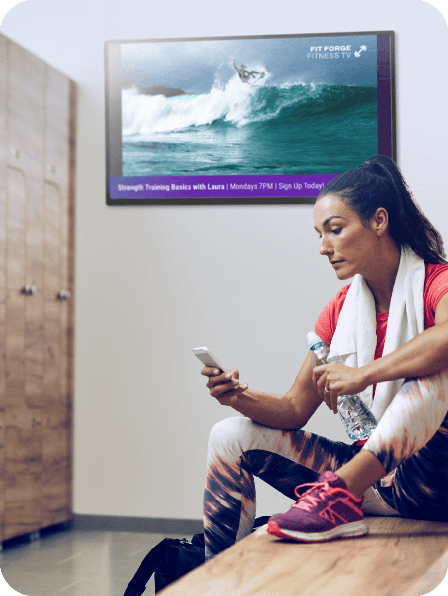 Illustration of a person standing in from of a bar looking at the Rockbot App on their phone with two TVs in the background