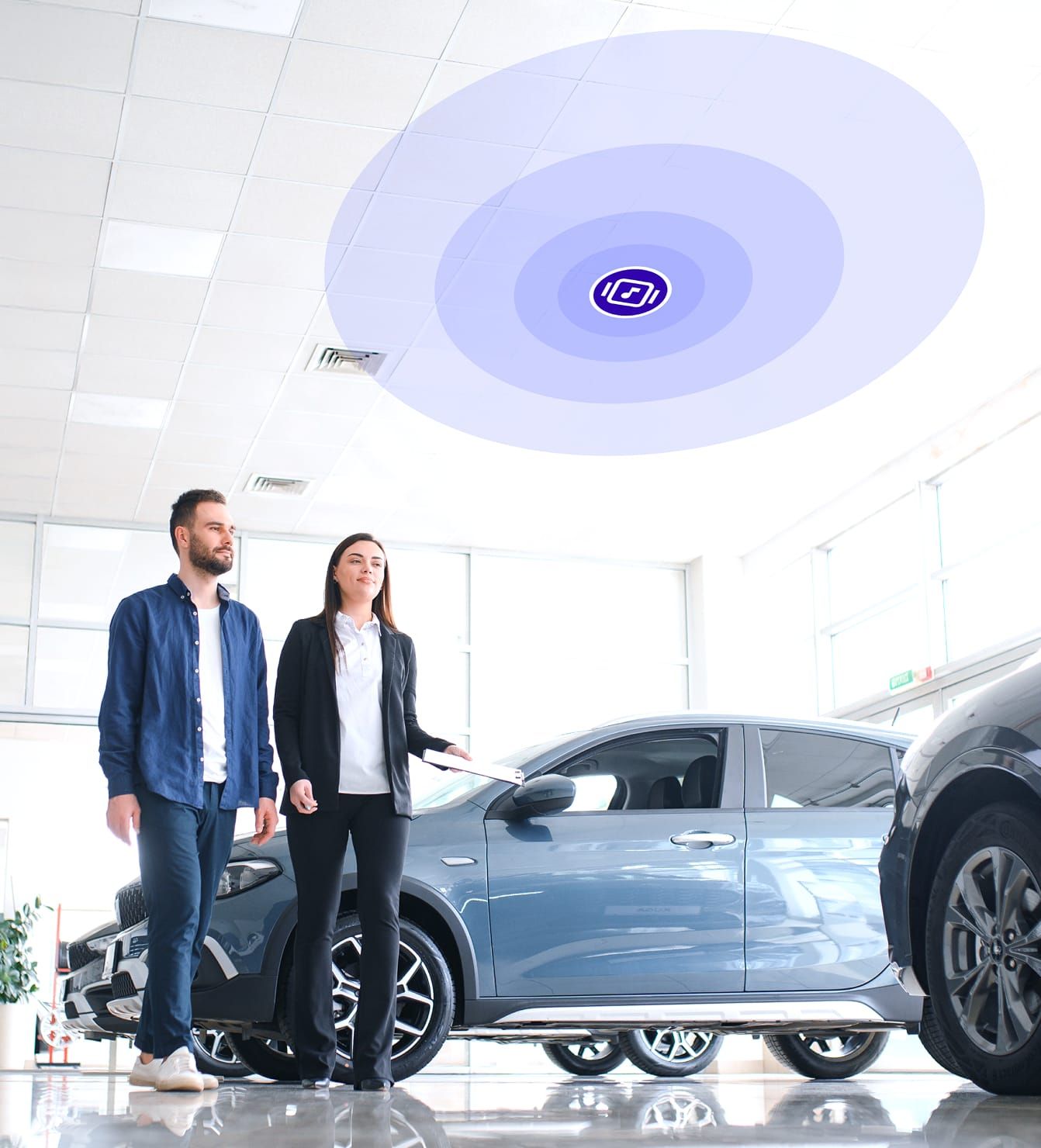 People in car showroom with music icon above