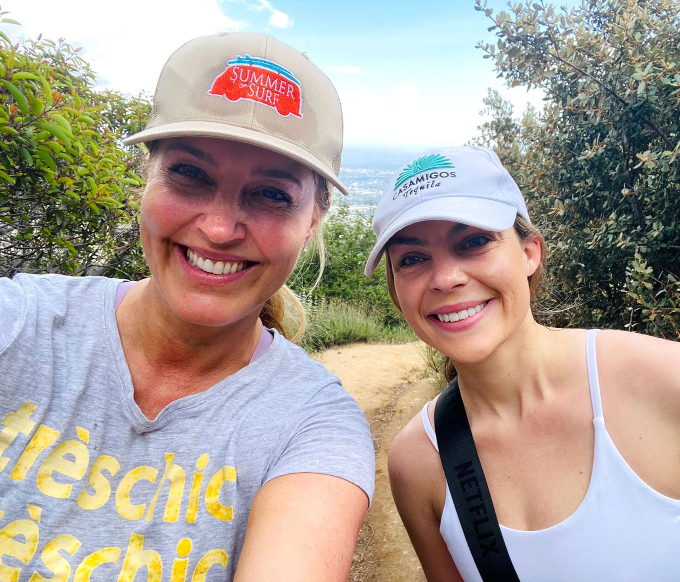 2 people hiking and posing for a selfie together