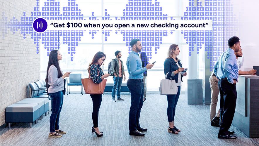A group of people waiting in line at a bank while Rockbot Audio Messaging plays