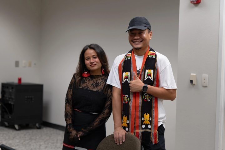 Photograph of two event attendees posing together at the First Naga Baptist Fundraising Cultural Event.