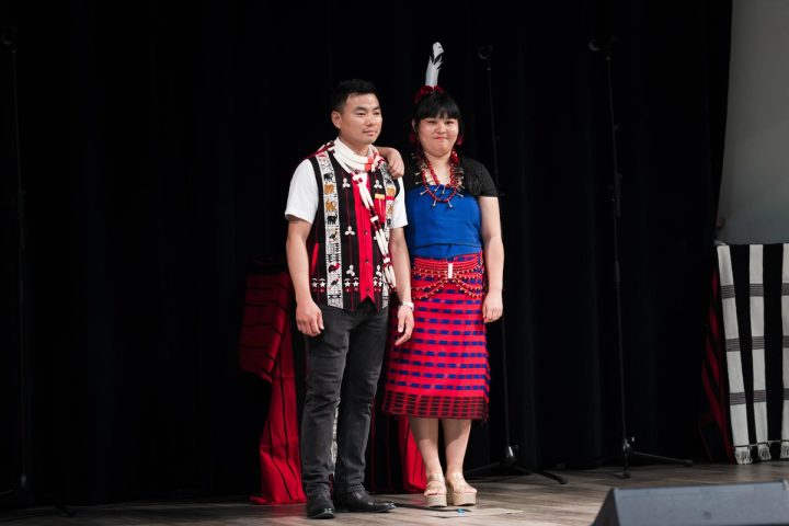 Photograph of performers posing together on stage at the First Naga Baptist Fundraising Cultural Event.