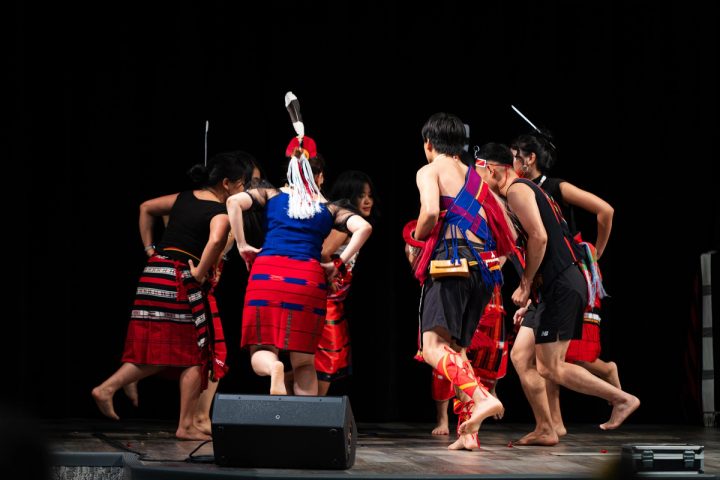 Photograph of dancers performing on stage at the First Naga Baptist Fundraising Cultural Event.
