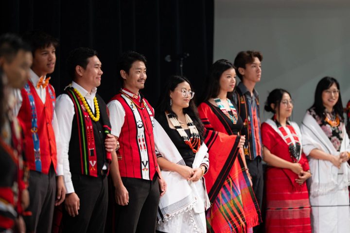 Photograph of performers standing together on stage at the First Naga Baptist Fundraising Cultural Event.