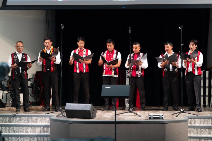 Photograph of a group of musicians performing together at the First Naga Baptist Fundraising Cultural Event.