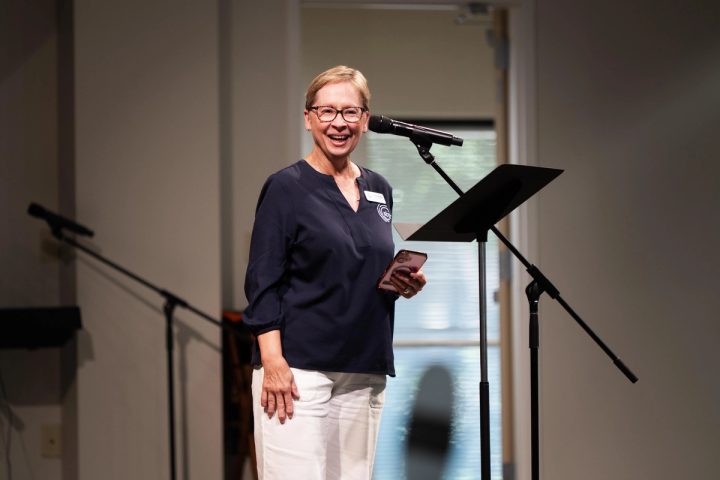 Photograph of a guest speaker addressing the audience from a lectern at the First Naga Baptist Fundraising Cultural Event.